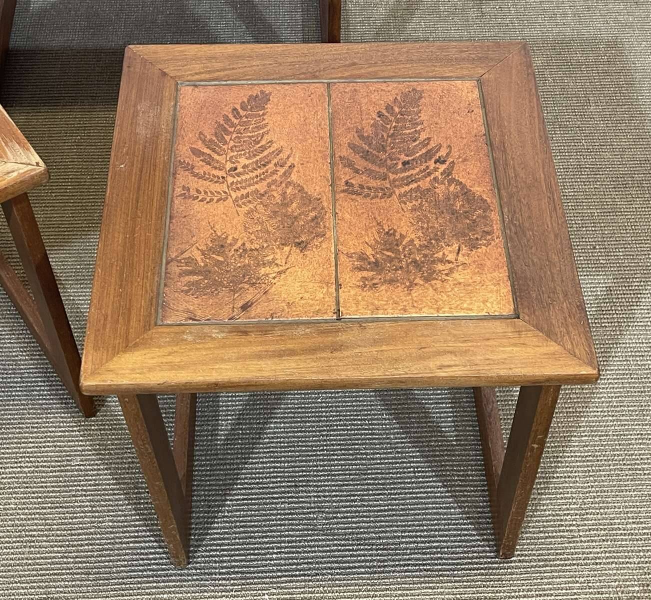 Set of 3 nesting tables in teak with tiled tops.