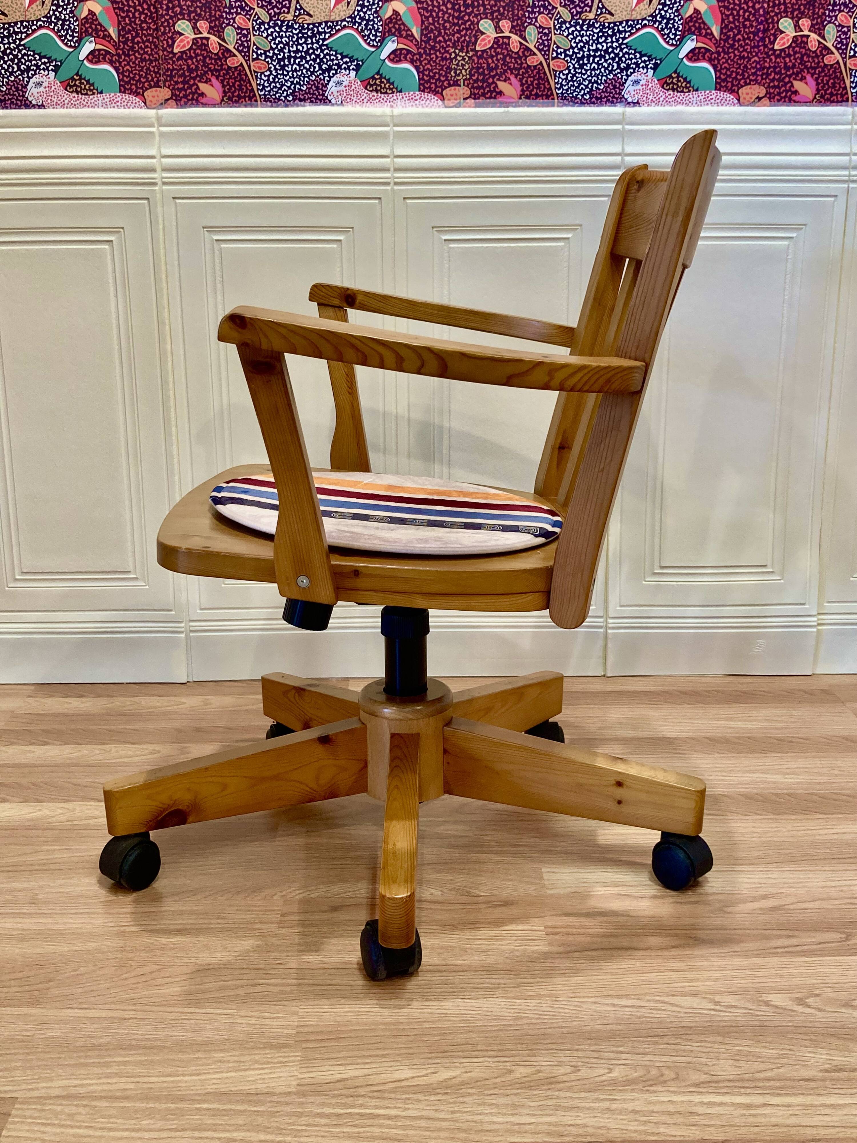 Solid wood swivel and reclining armchair.