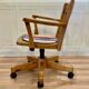 Solid wood swivel and reclining armchair.