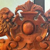 Pair of Louis XIII style armchairs in carved wood