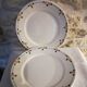 Six flat plates in faince Badonviller stylized flowers ochre and green