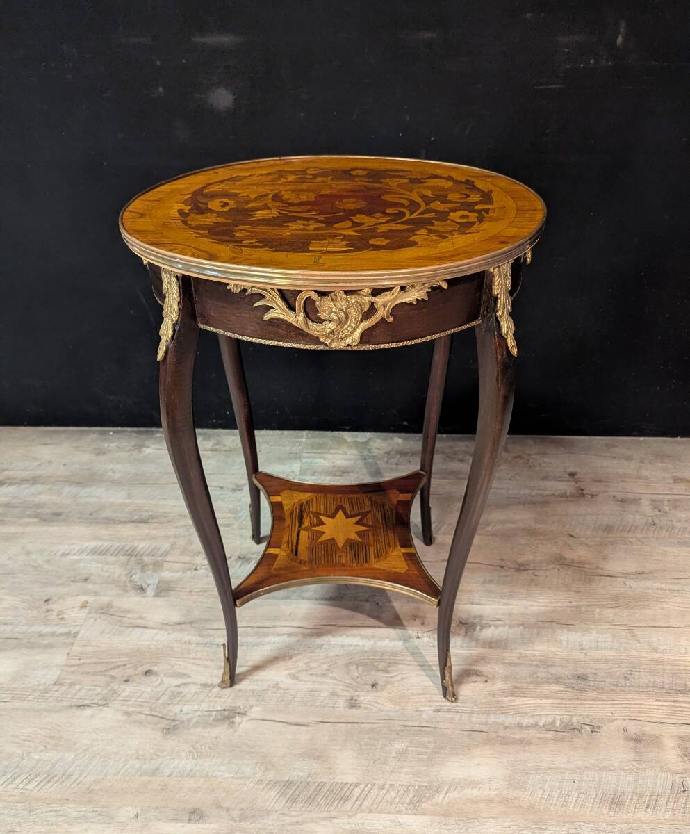 Louis XV style gueridon with floral marquetry.