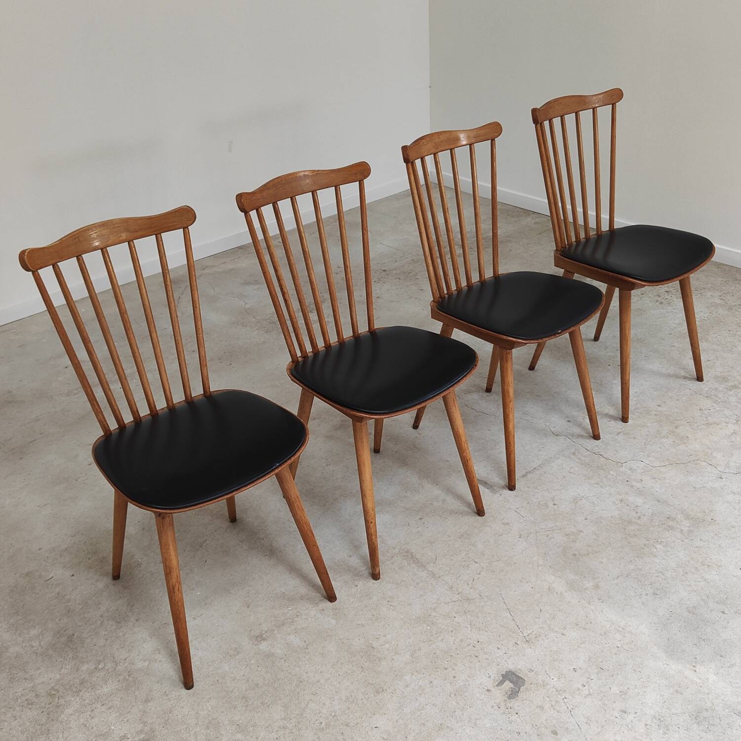 Set of 4 Baumann Menuet chairs black leatherette compass legs
