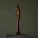 Sculpture of a woman and child in hand-carved wood, mid-20th century.