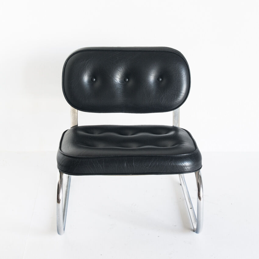 Vintage low armchair. Chrome metal and eskai - Spain, 1970s