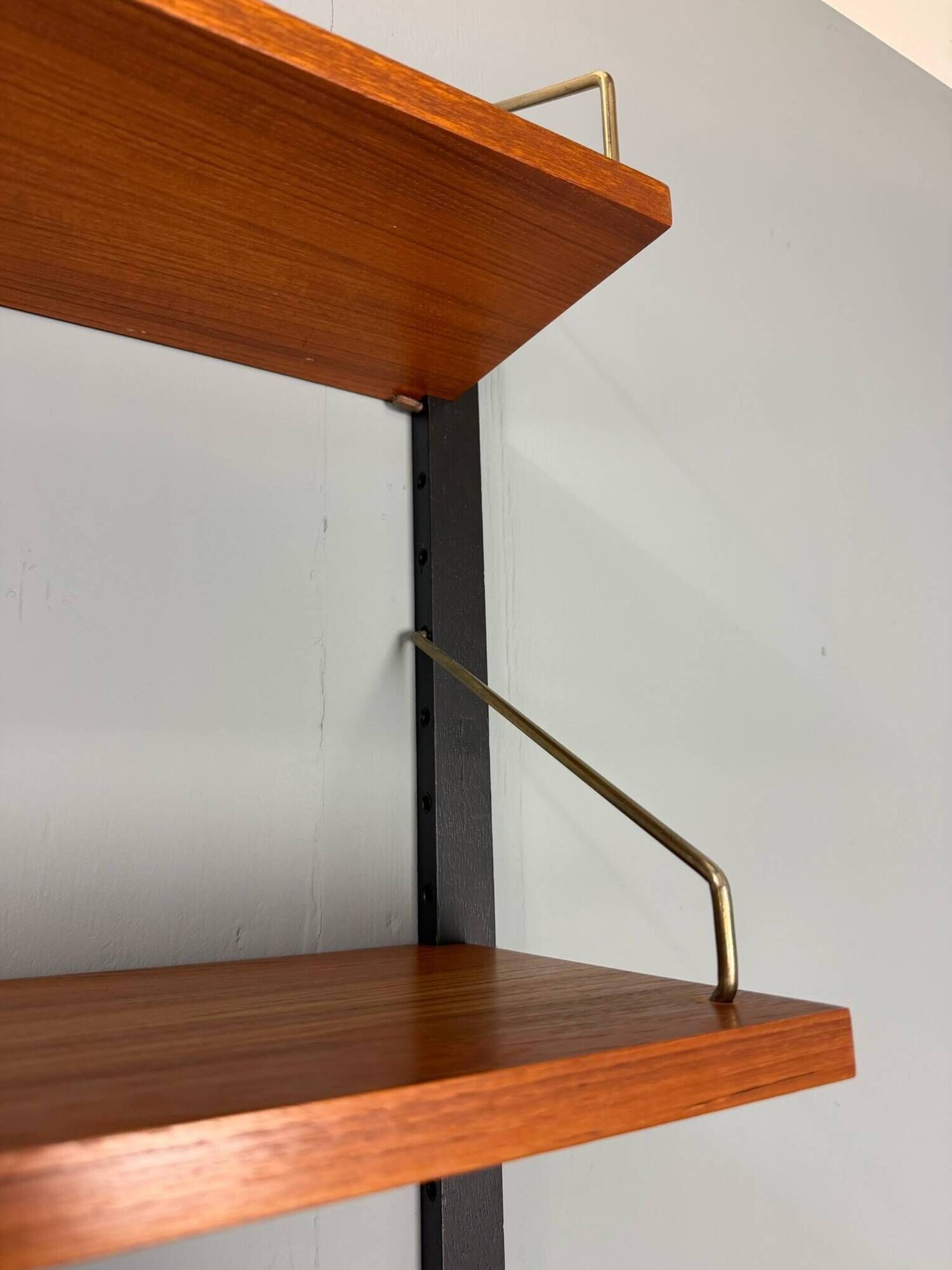 Modular wall shelf in teak in mid-century modern style, designed by Poul Cadovius for Cado, 1960.