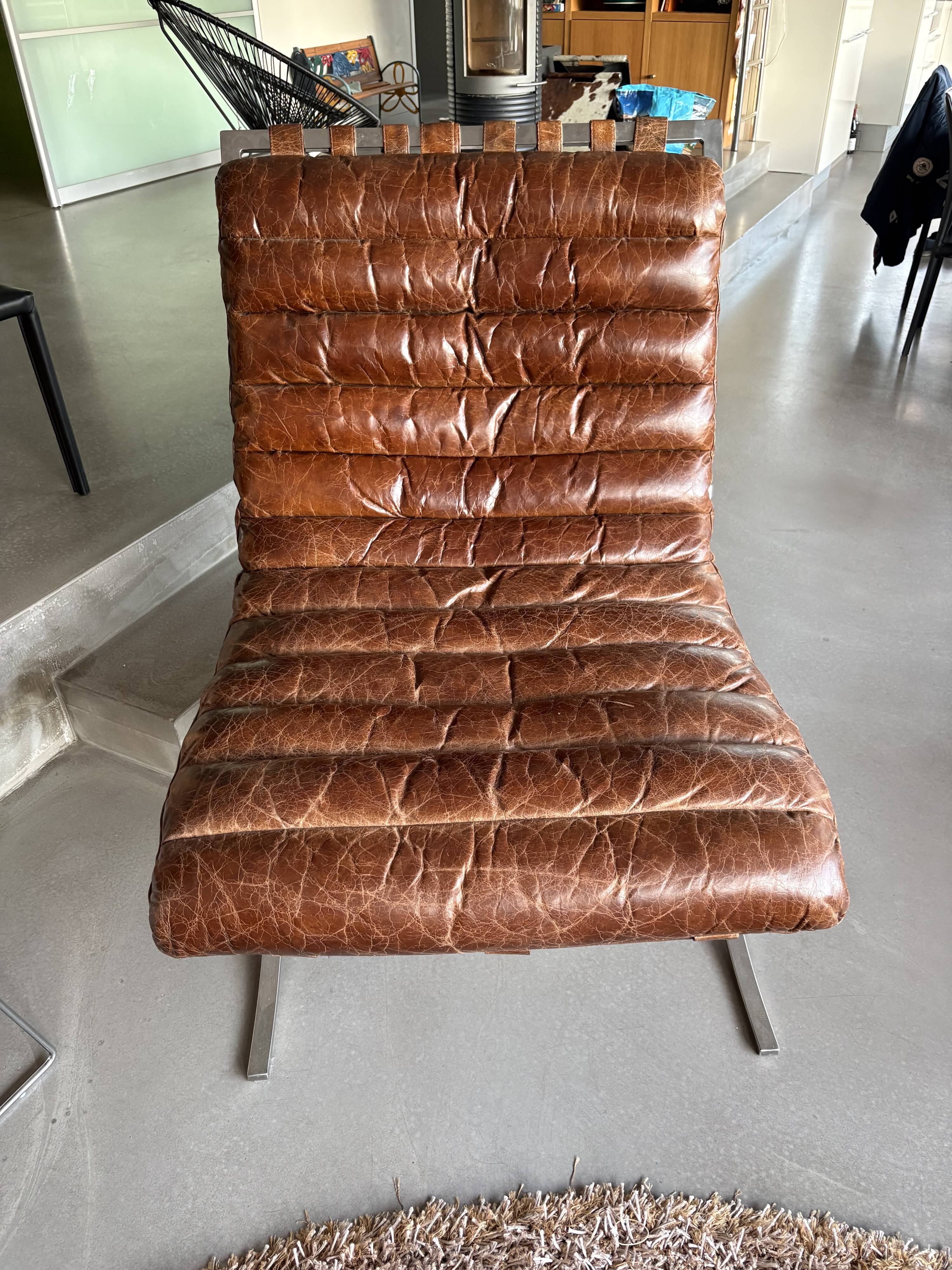Pair of brown leather armchairs