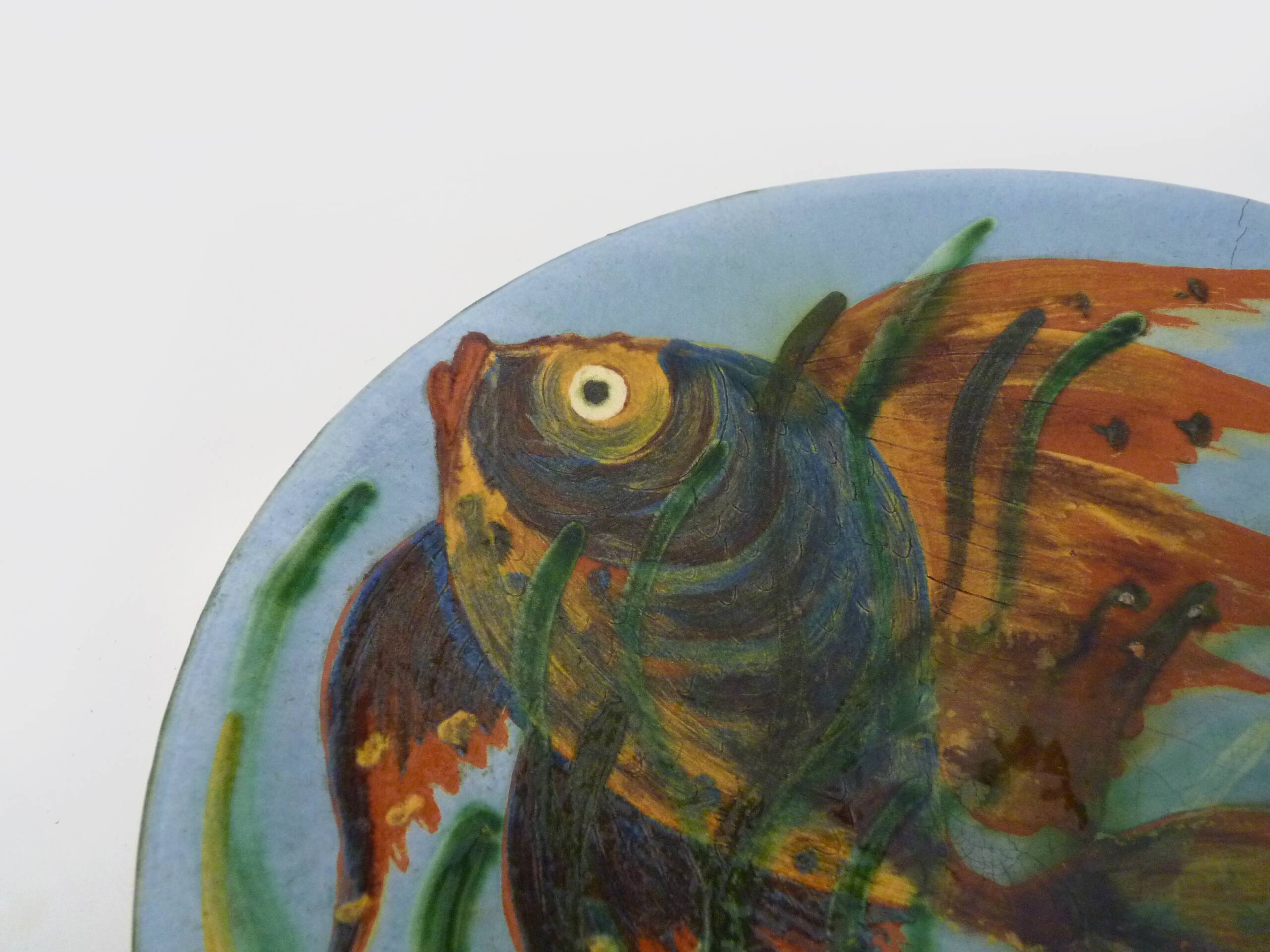 Decorative ceramic wall plate with fish decoration by Puigdemont.