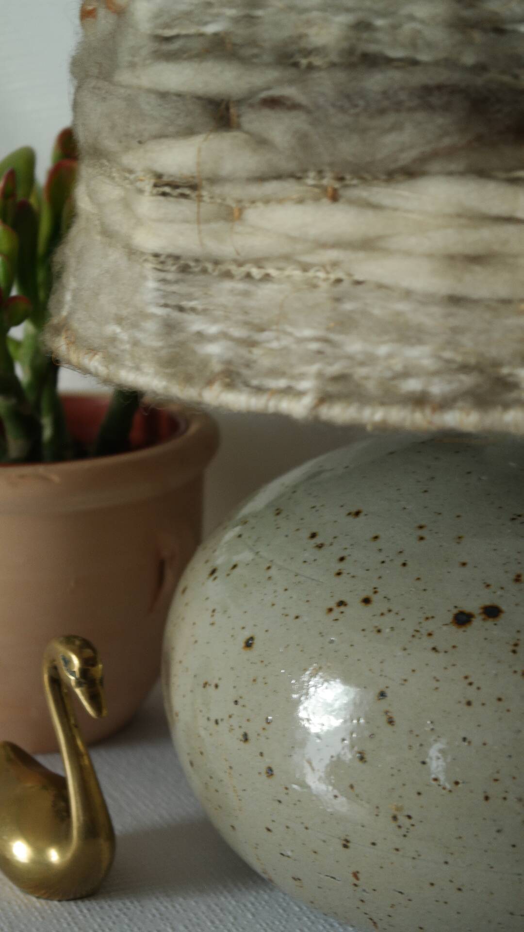 Vintage ceramic lamp with a wool shade.