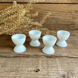 4 egg cups in white opaline glass
