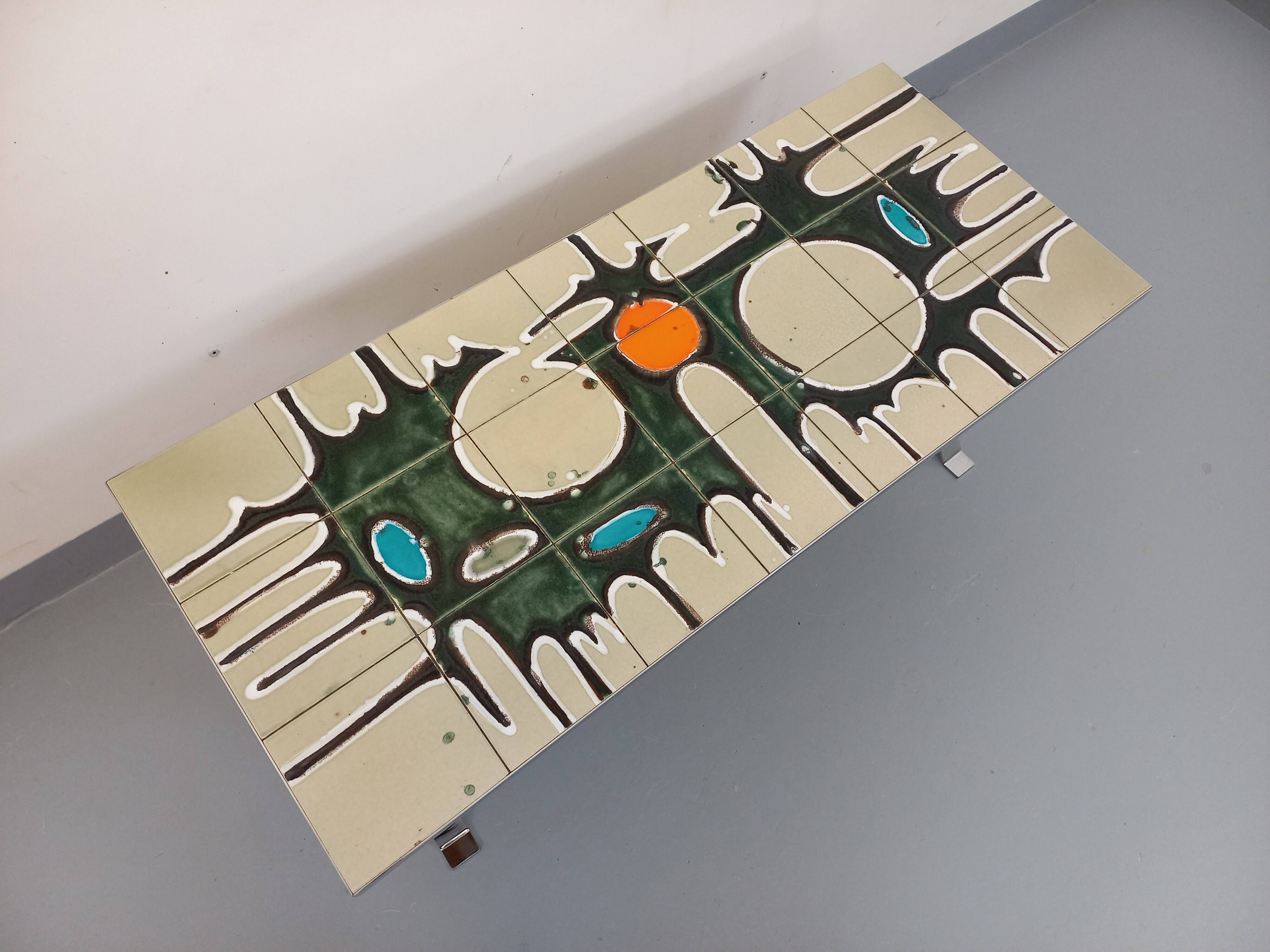 Vintage coffee table from the 60s and 70s in ceramic, chrome metal, and wood.