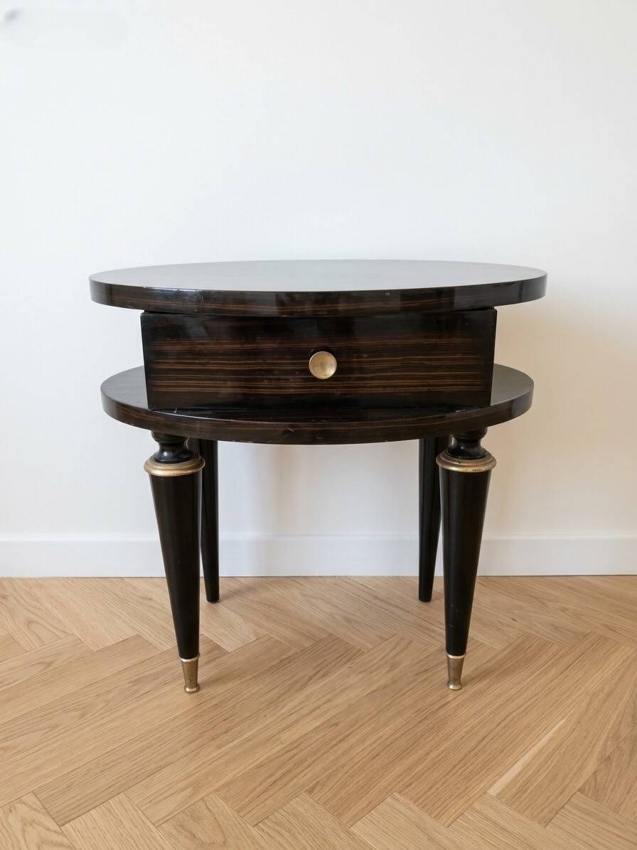 Art Deco bedside table in black wood with gold details.