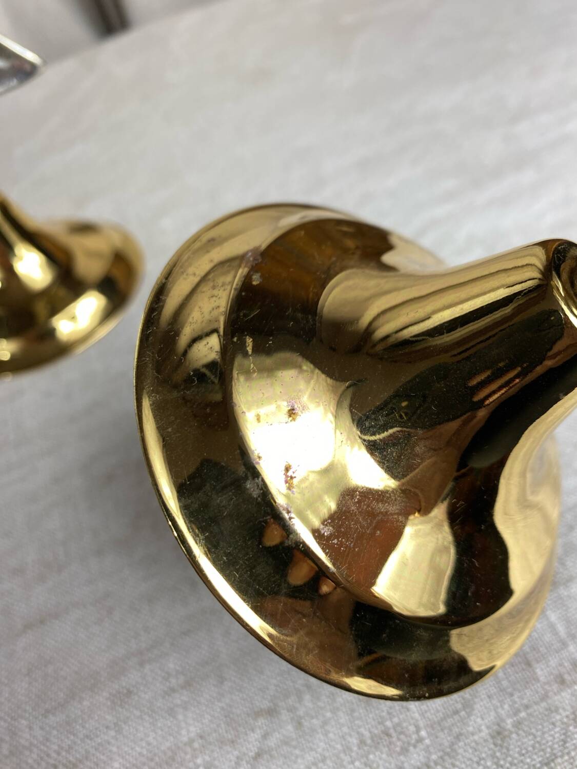 Pair of silver and gold metal candlesticks