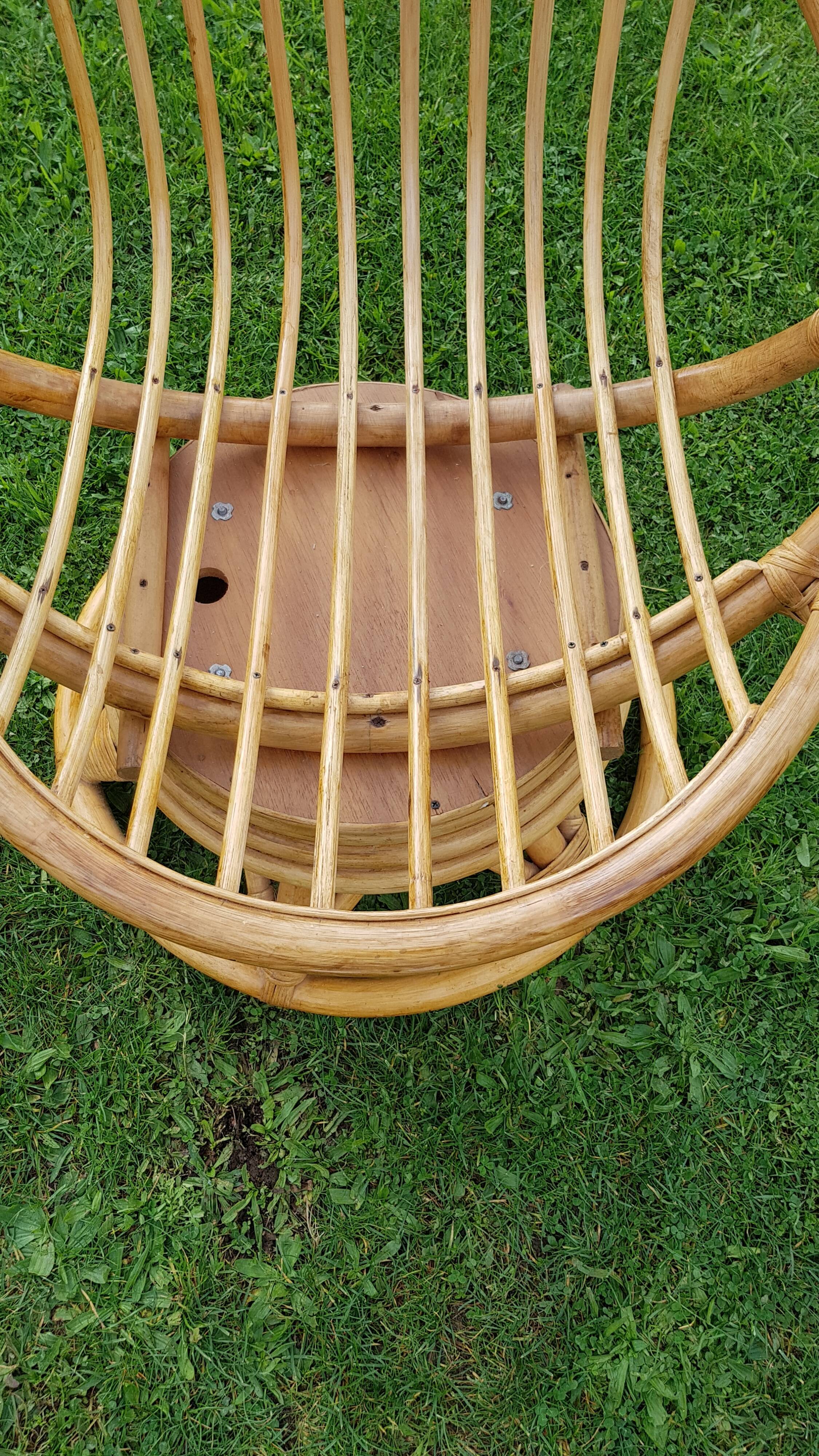 Pair of swivel rattan armchairs