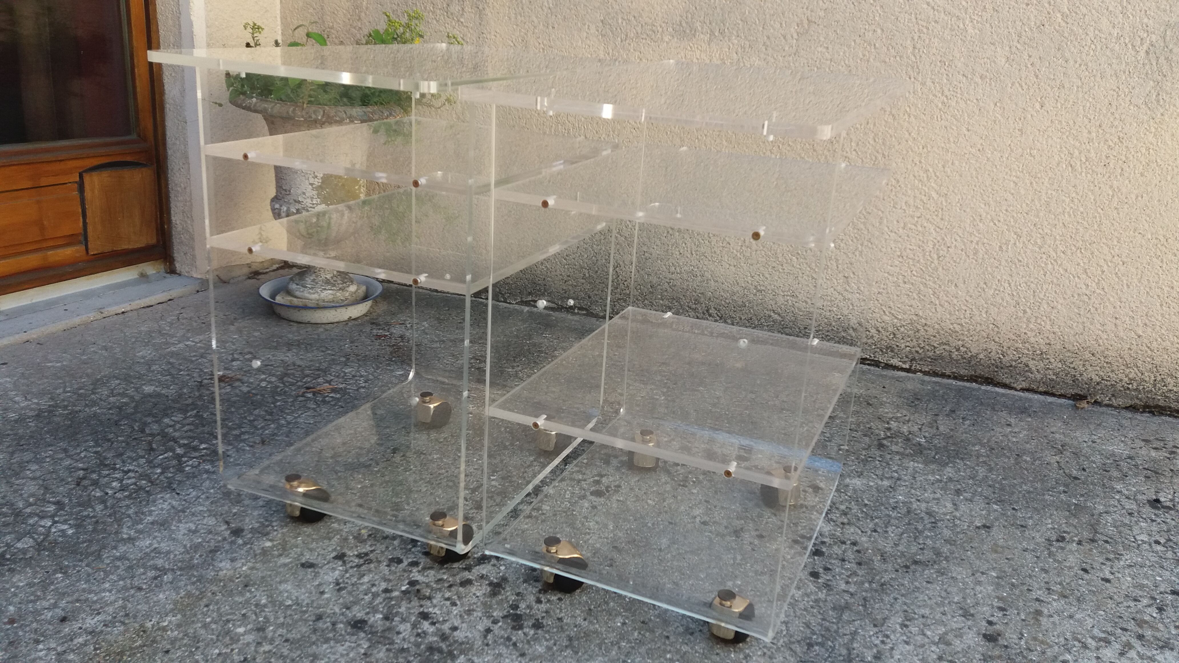Pair of Plexiglas services branded "Les Invisibles du Marais"