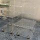 Pair of Plexiglas services branded "Les Invisibles du Marais"