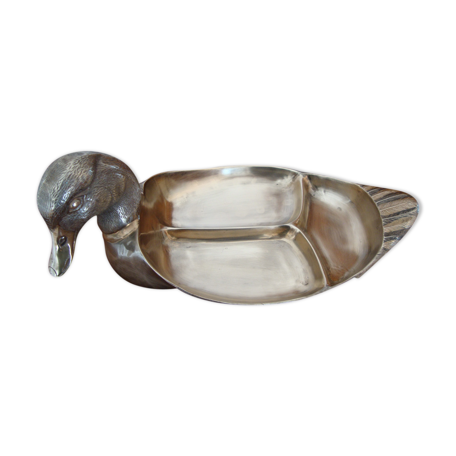 Empty pocketed old duck in solid brass