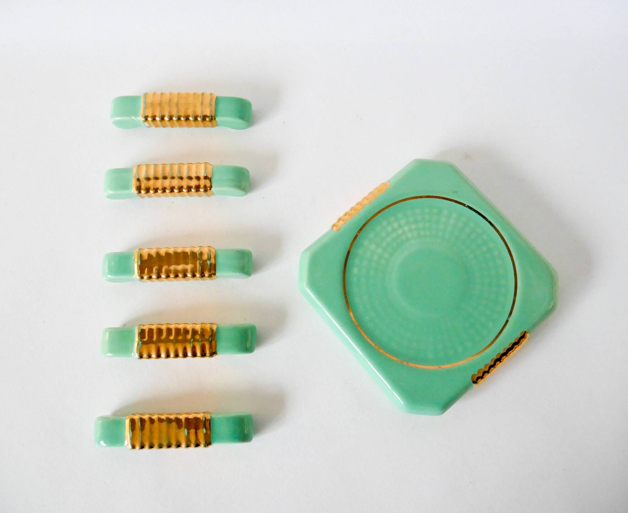 set of coasters and knife holders in mint green and gold art deco ceramic 1930