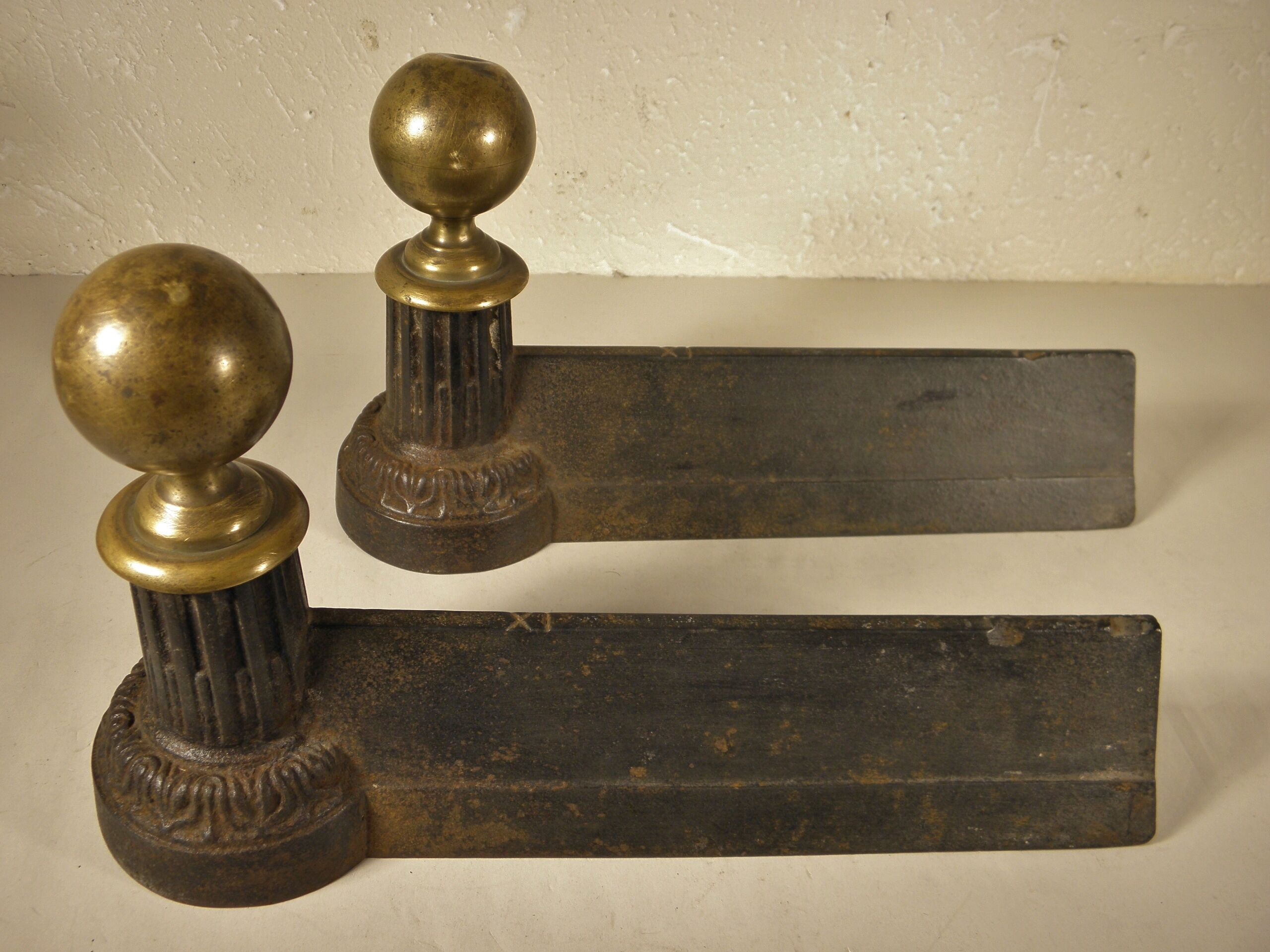 Pair of cast iron and brass chenets