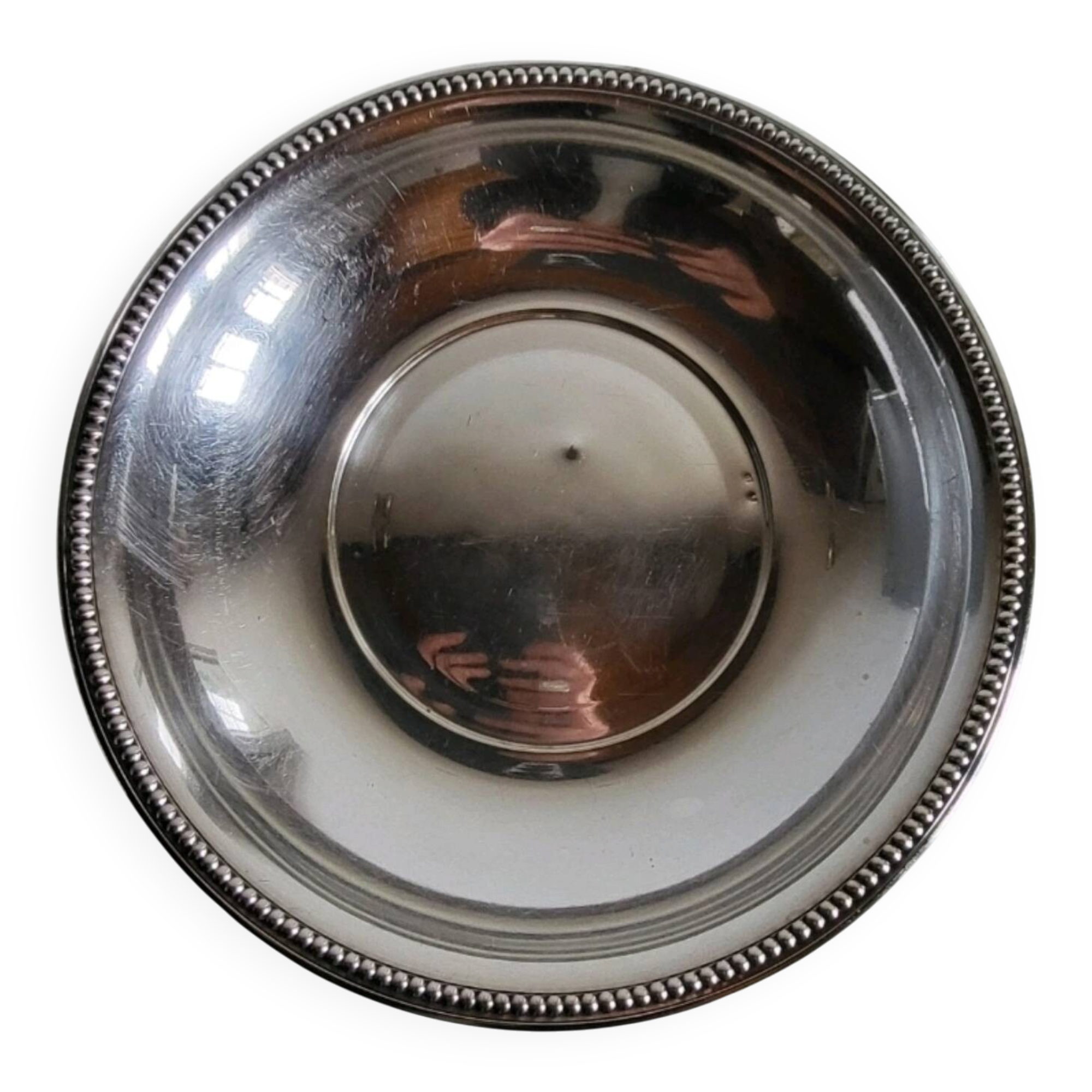 Shallow round metal plate with pearl row decoration.