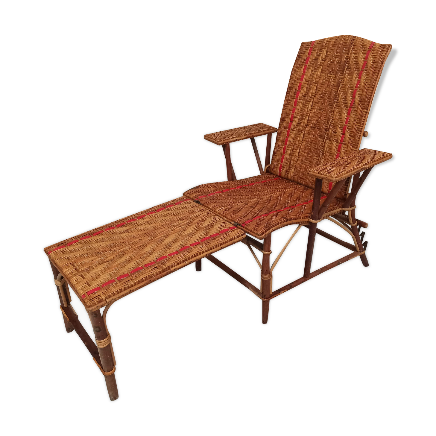 Sunbathing sunbathing in wicker rattan wood deckchair red lounger