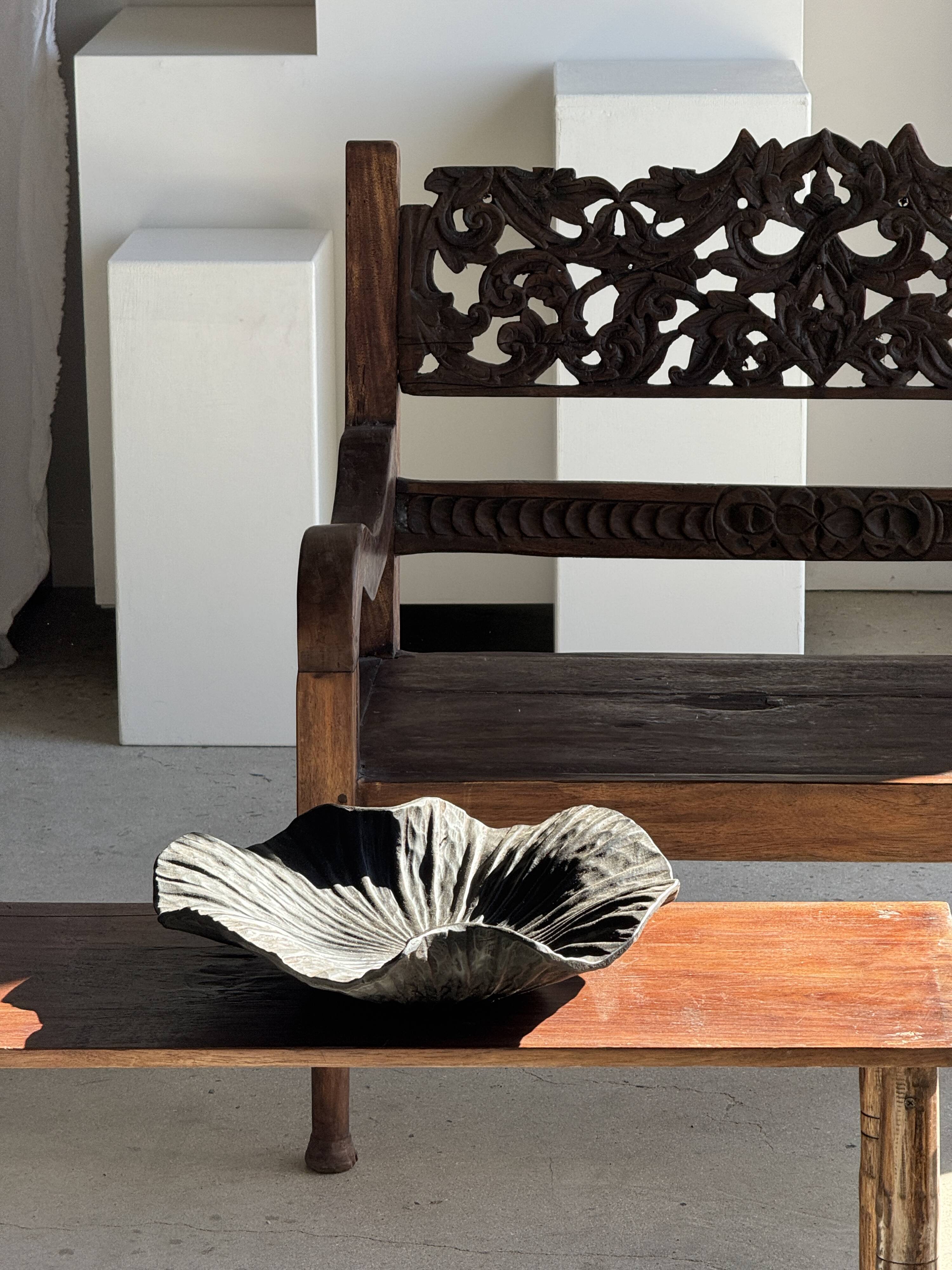 Black solid mango side table (monoxyle) with conical legs