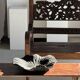 Black solid mango side table (monoxyle) with conical legs