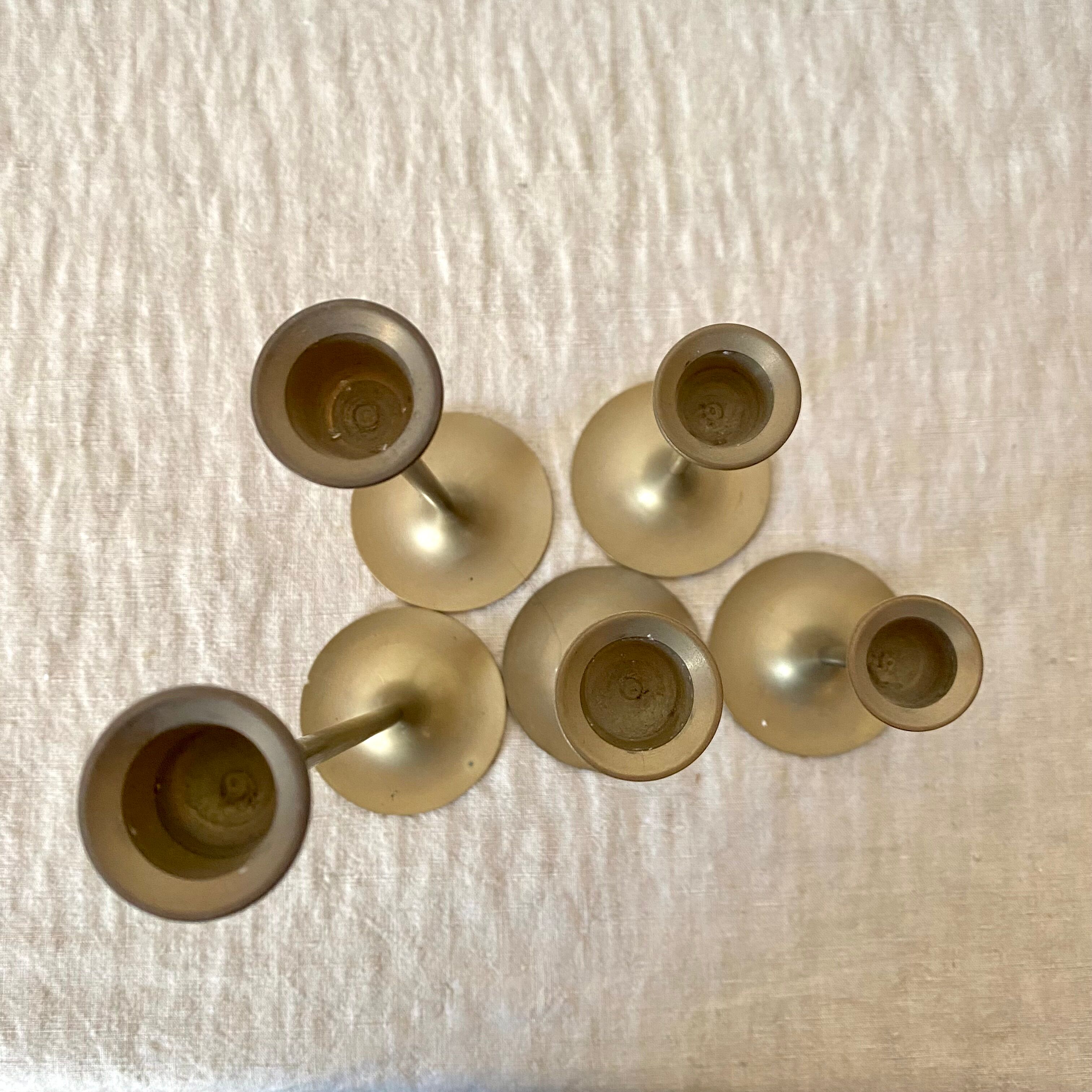 Series of brass candle holders