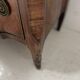 Transitional style chest of drawers in rosewood and amaranth veneer, 20th century.