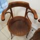 Pair of curved wooden armchairs
