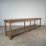 Beautiful 19th-century draper's table in oak with six fluted legs.