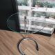 End of sofa, pedestal table, side table paget top in chrome-plated glass base