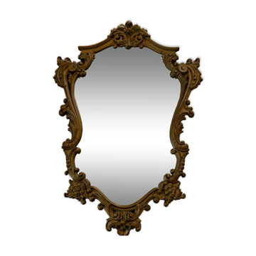 Antique mirror in Louis XV Rococo style with carved frame.