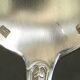 Set of 11 SFAM silver metal teaspoons.