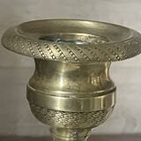 Pair of chiselled brass candlesticks from the 19th century.