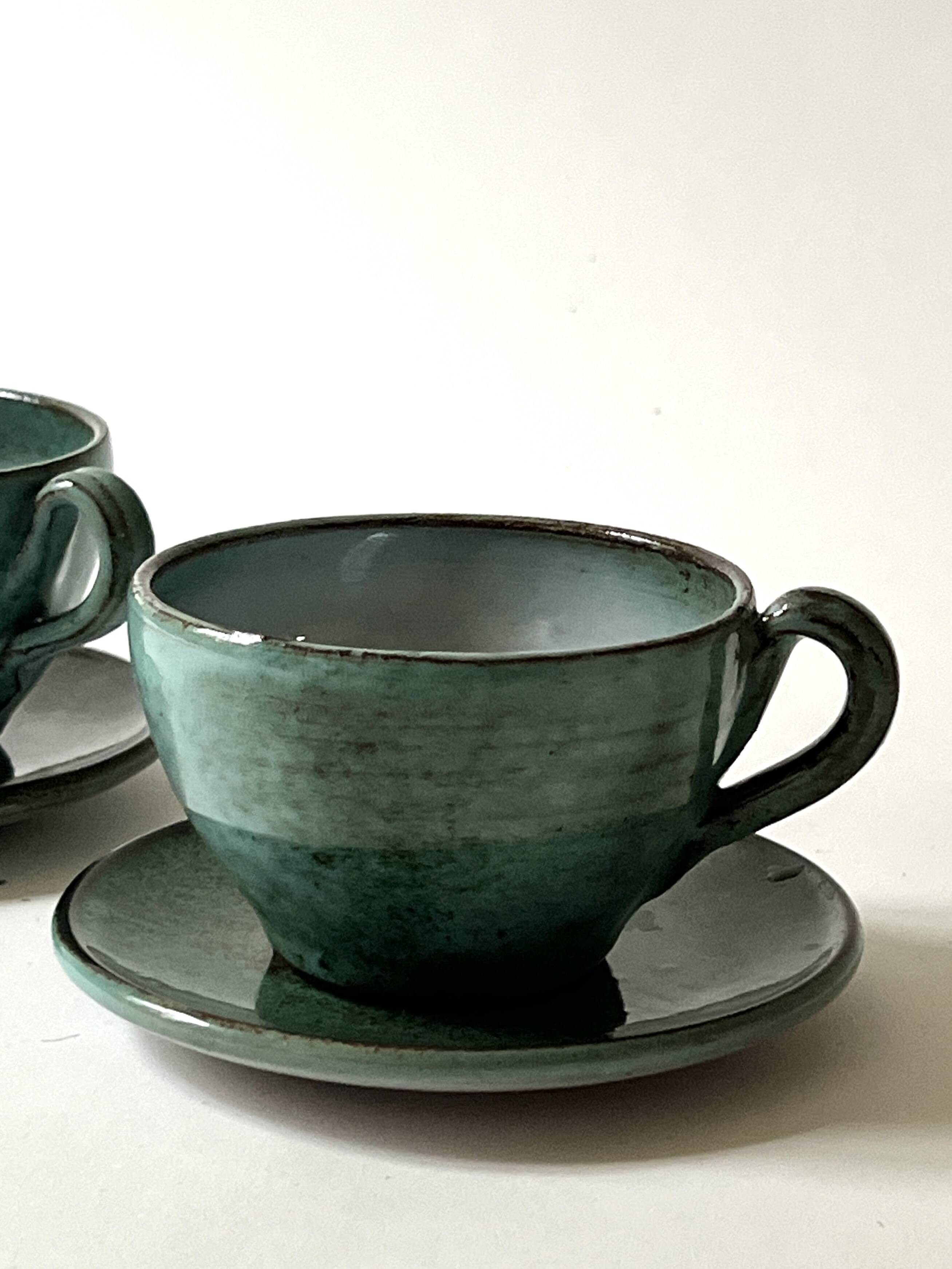 Handmade and signed glazed ceramic coffee cups, circa 1950.
