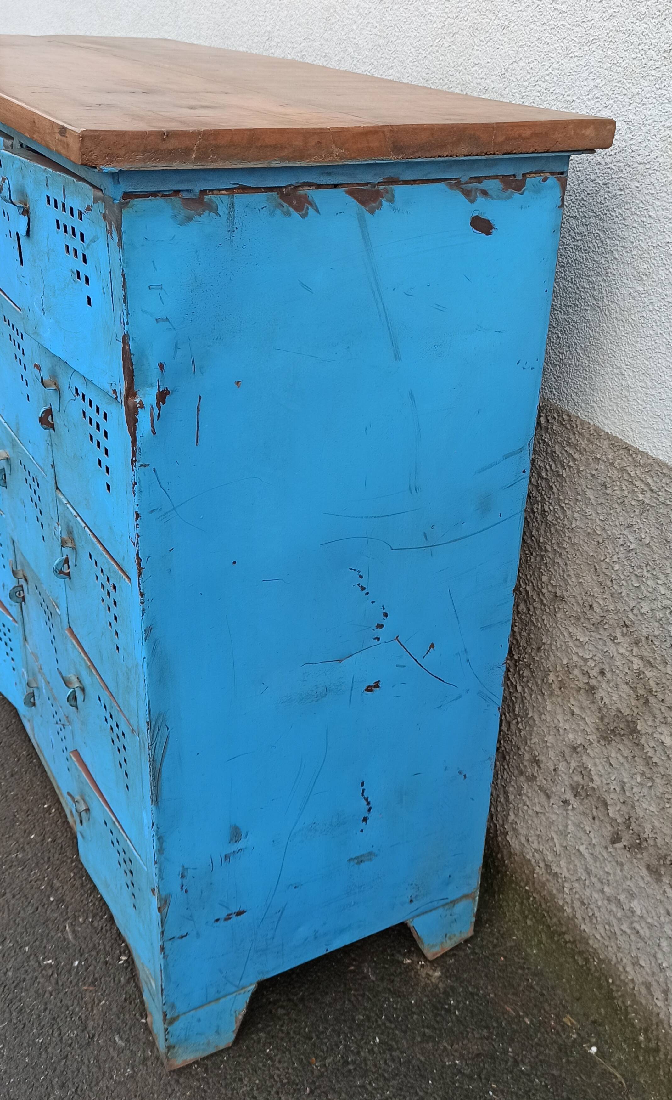 Old blue metal locker with wooden top