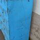 Old blue metal locker with wooden top