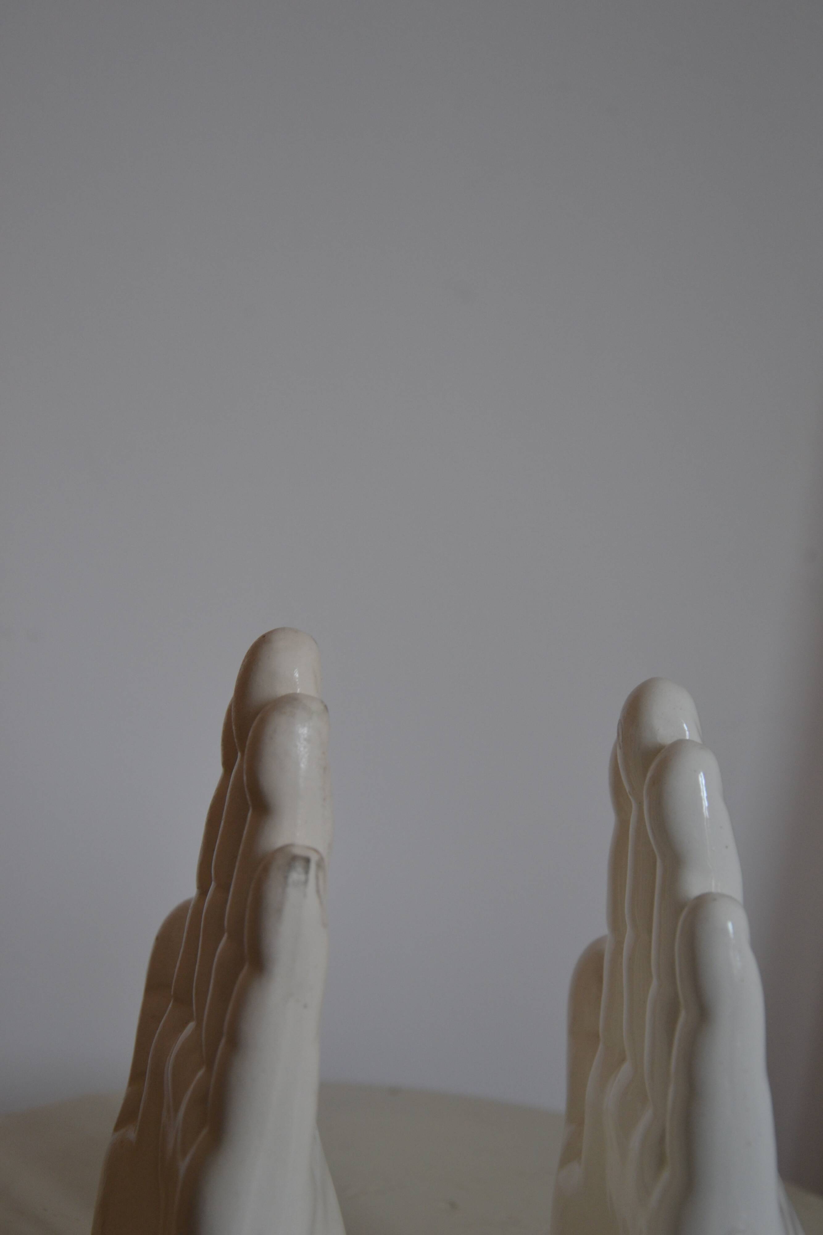 Handends in the shape of vintage white ceramic