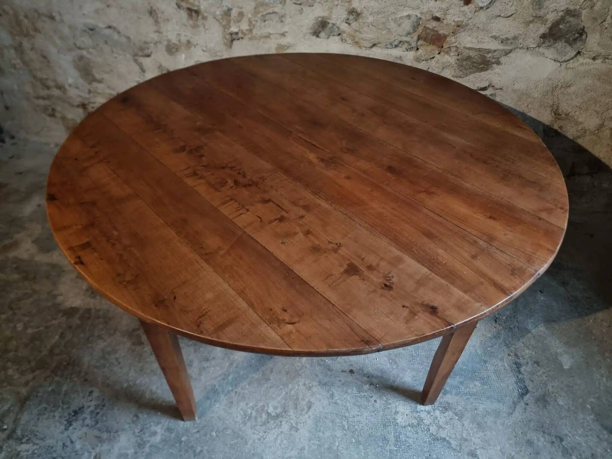 Antique round dining table in cherry wood, France, circa 1920.