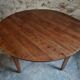 Antique round dining table in cherry wood, France, circa 1920.