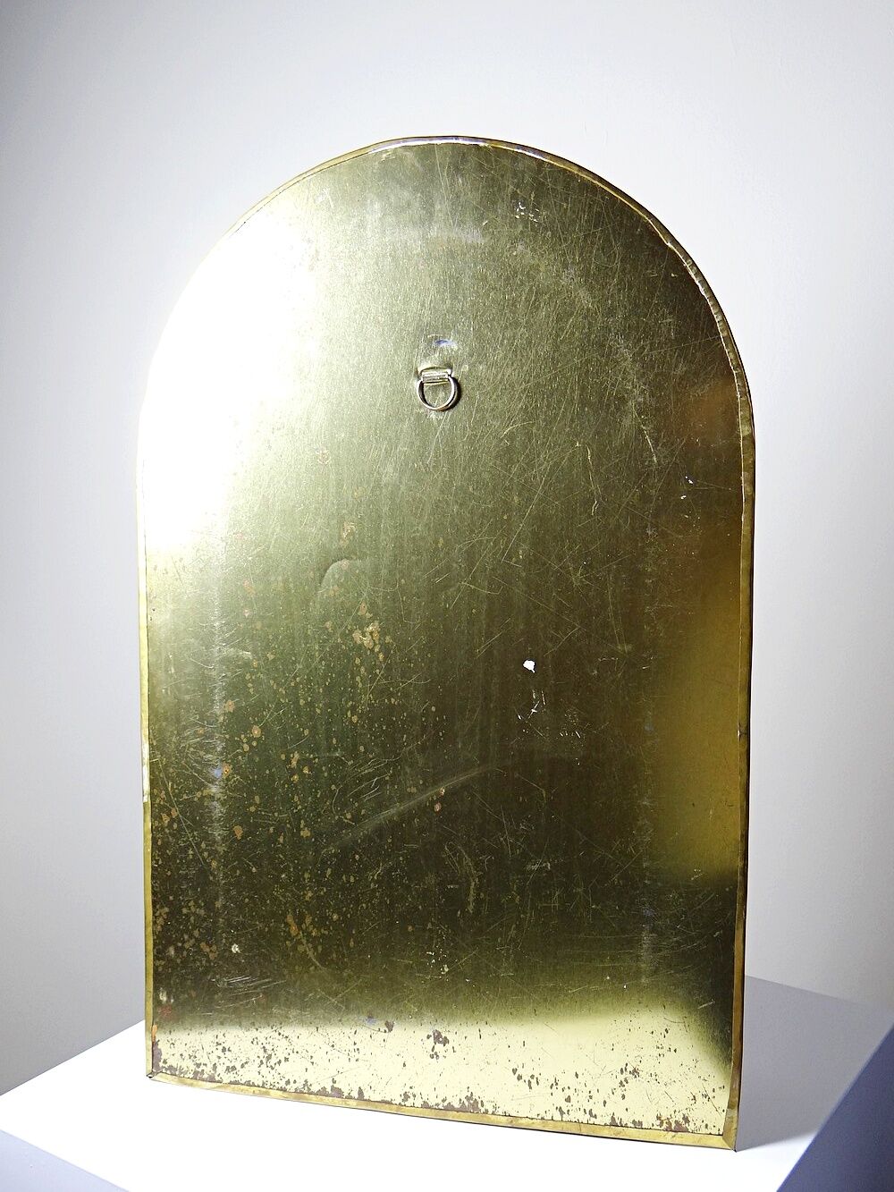 Large vintage Moroccan artisan wall mirror from the 50s-70s, made of solid brass, arch-shaped.