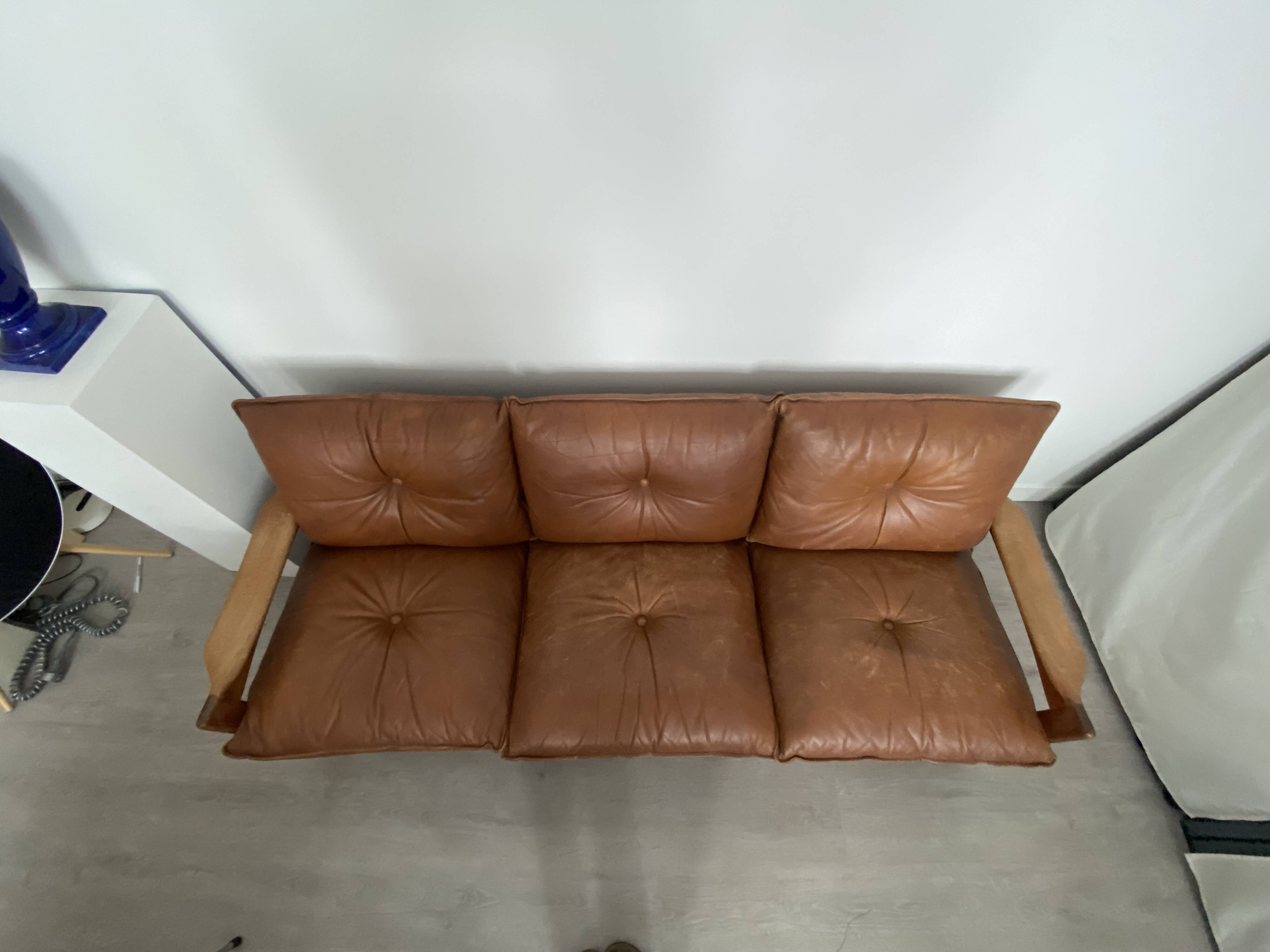 Scandinavian sofa in brown leather and solid wood