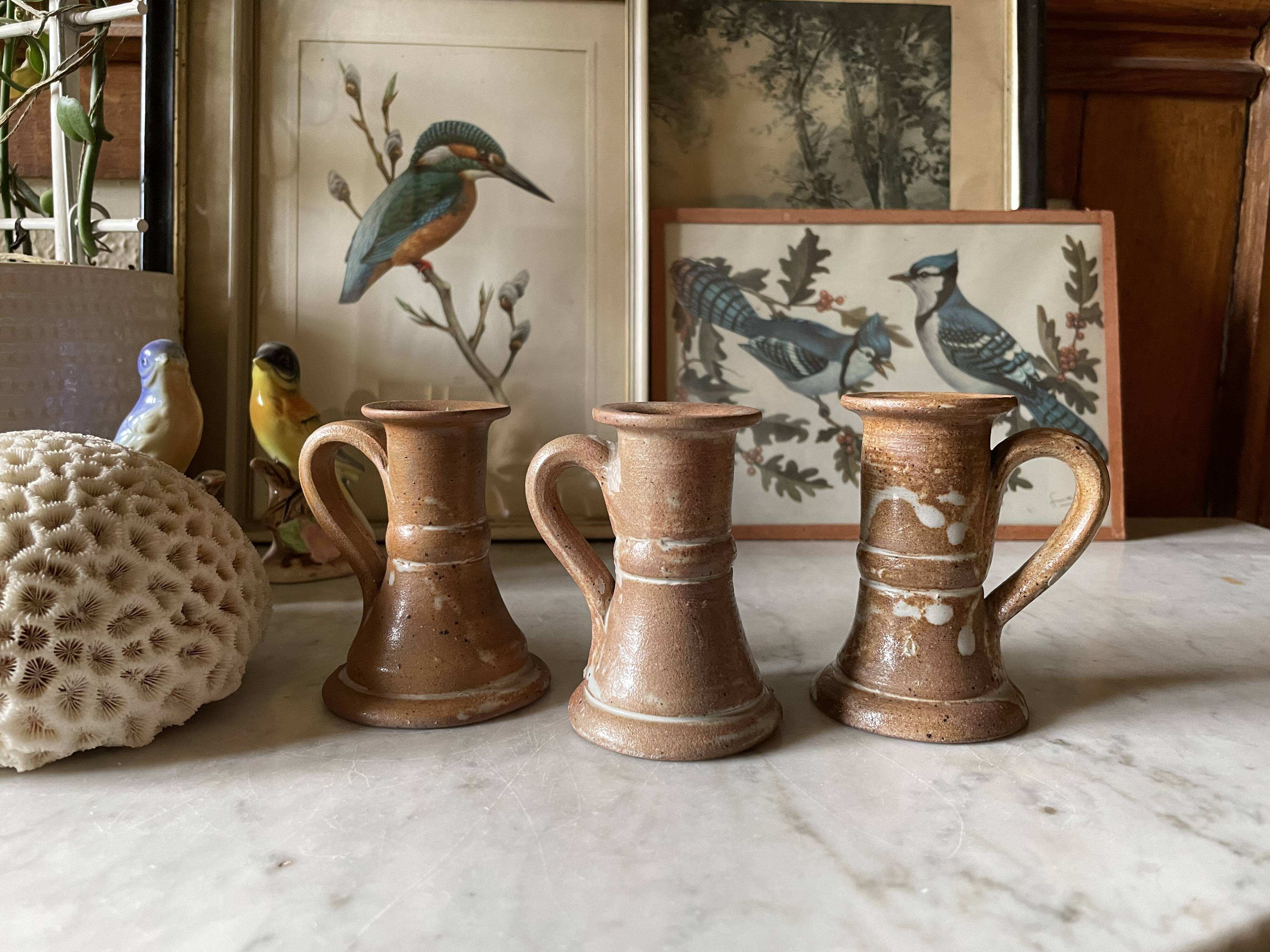 Trio of stoneware candle holders