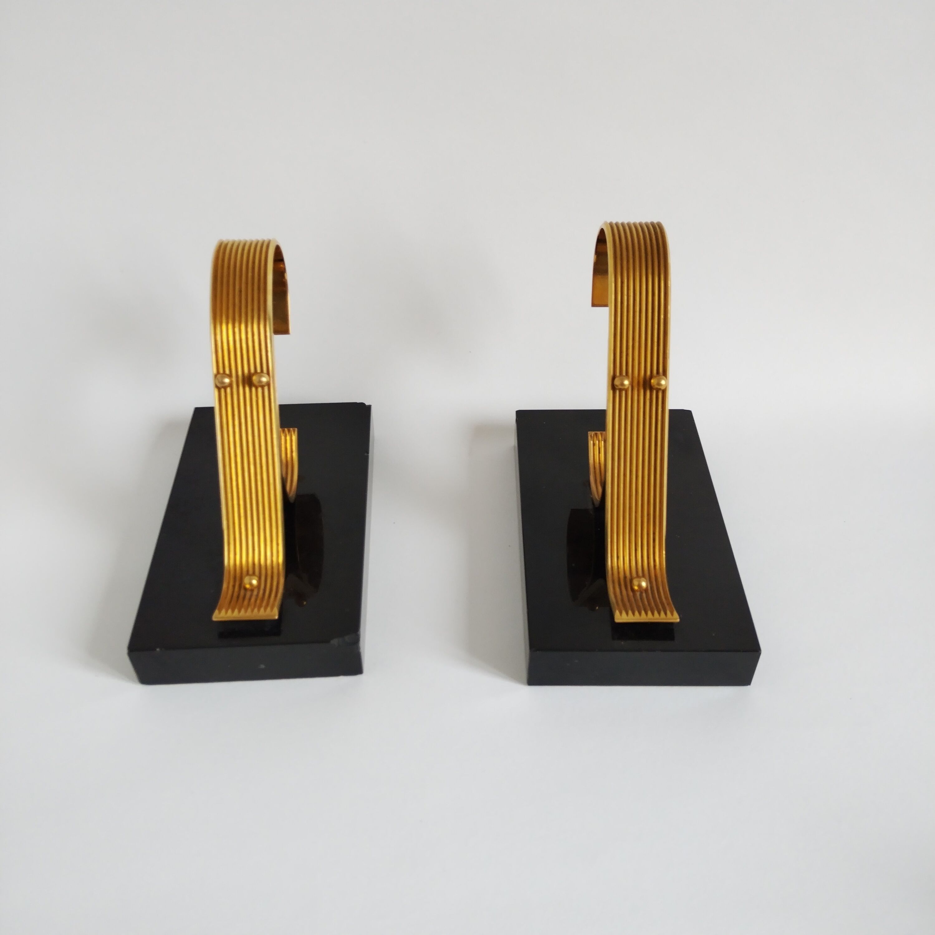Pair of vintage Art Deco style bookends in marble and gold-plated metal