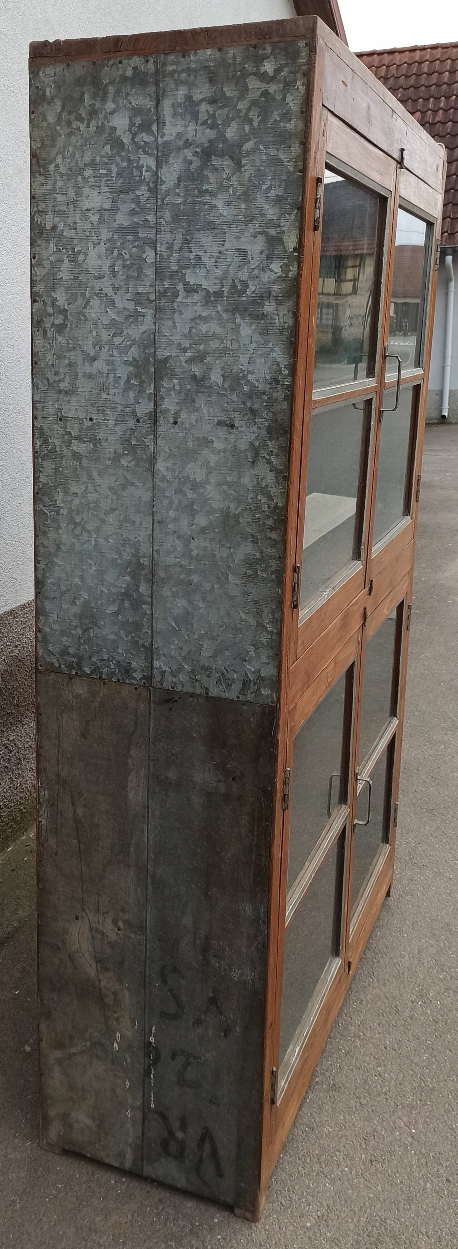 Old glass cabinet in wood and metal