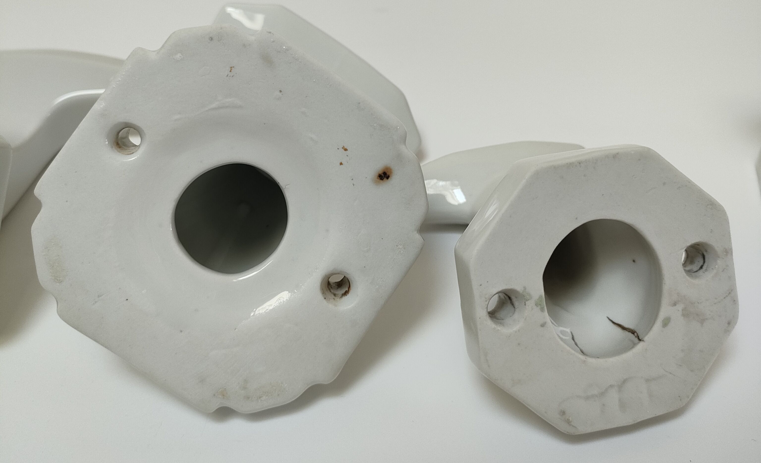 Five art deco white porcelain hooks