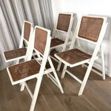4 folding chairs with wicker seating