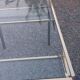 Golden and iridescent metal desk with a glass top from the 70s/80s.