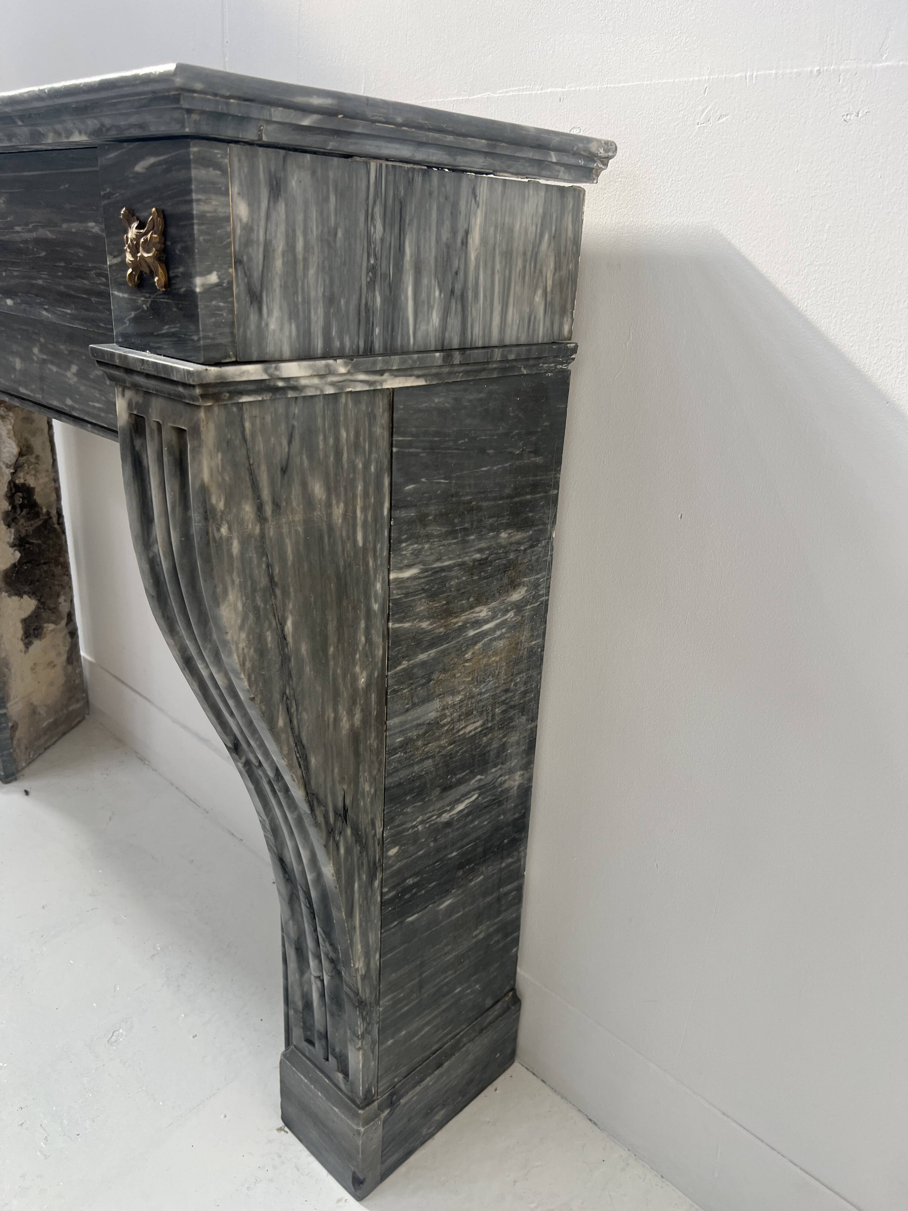Napoleon III fireplace in blue Turquin marble from the 19th century.